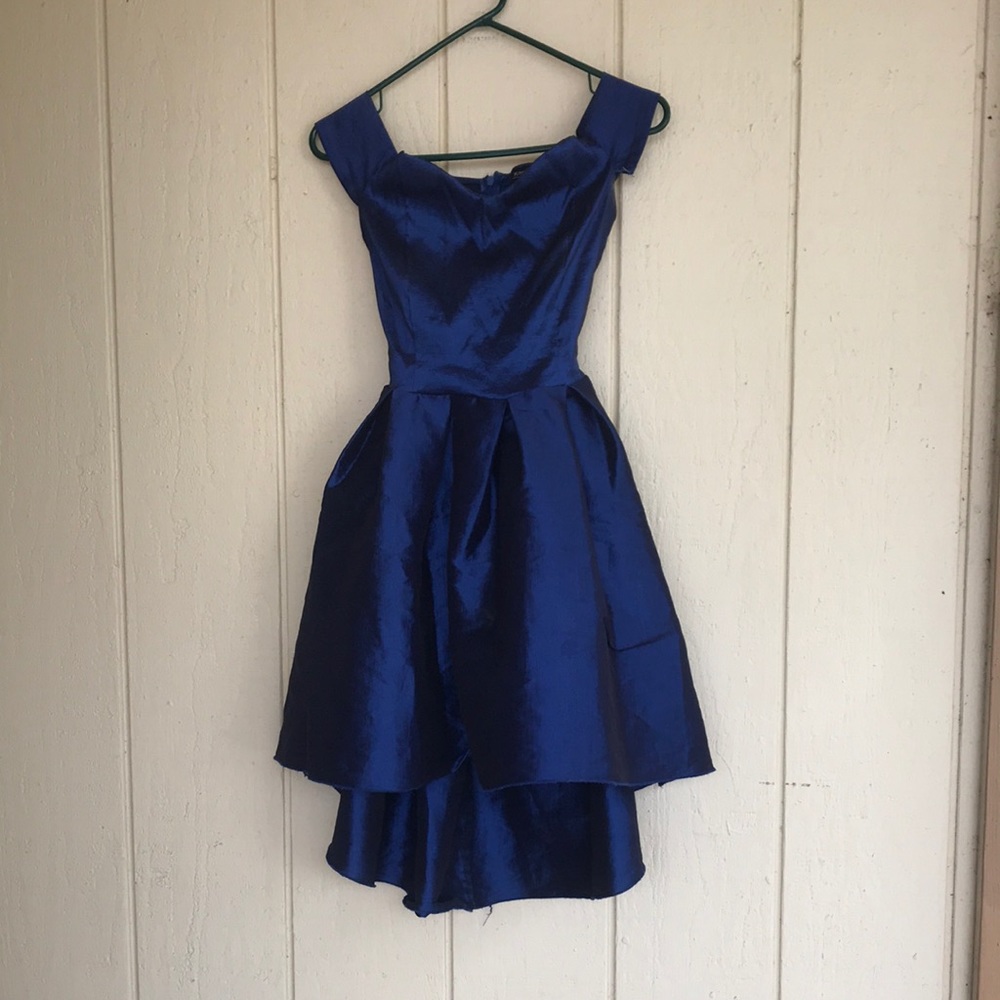 Blue shiny dress with ribbon in back